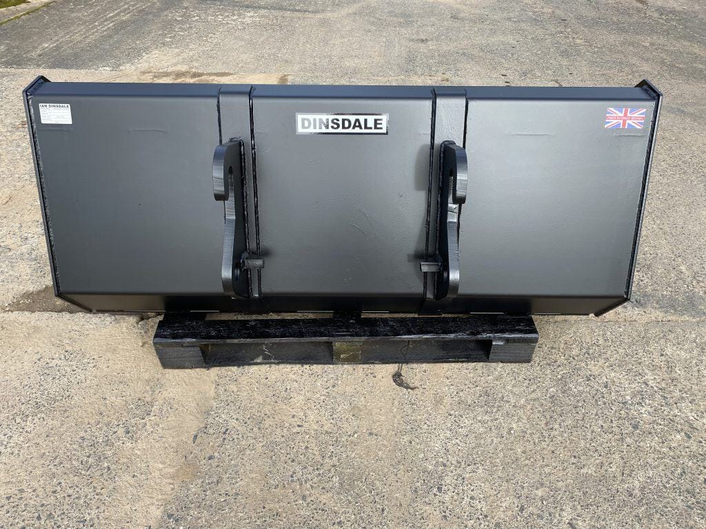 Heavy-duty grey skid steer bucket with quick-attach system for construction and farming equipment.