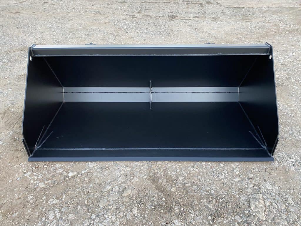 Black metal tractor bucket for skid steer, loader, or excavator with reinforced walls.
