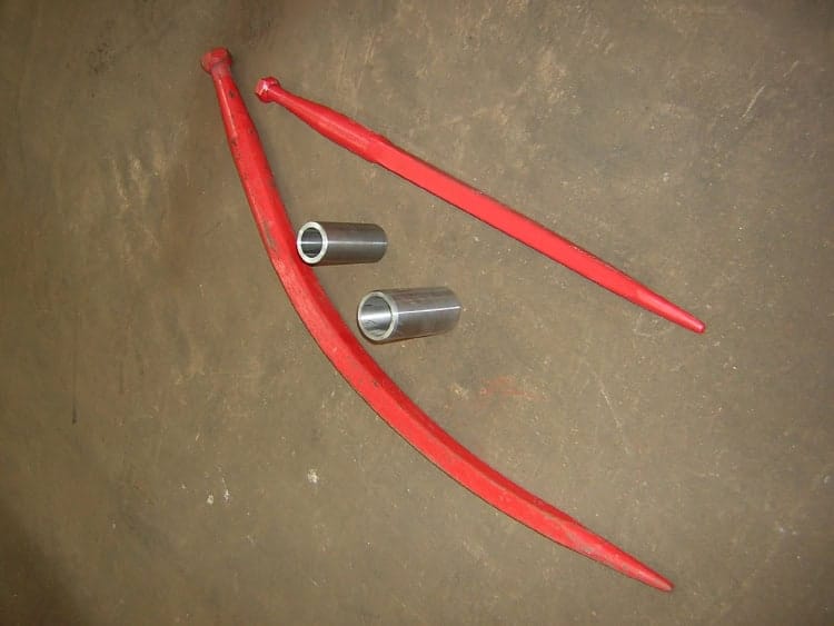 High-quality excavator boom and pins for heavy machinery. Durable steel components for construction equipment.