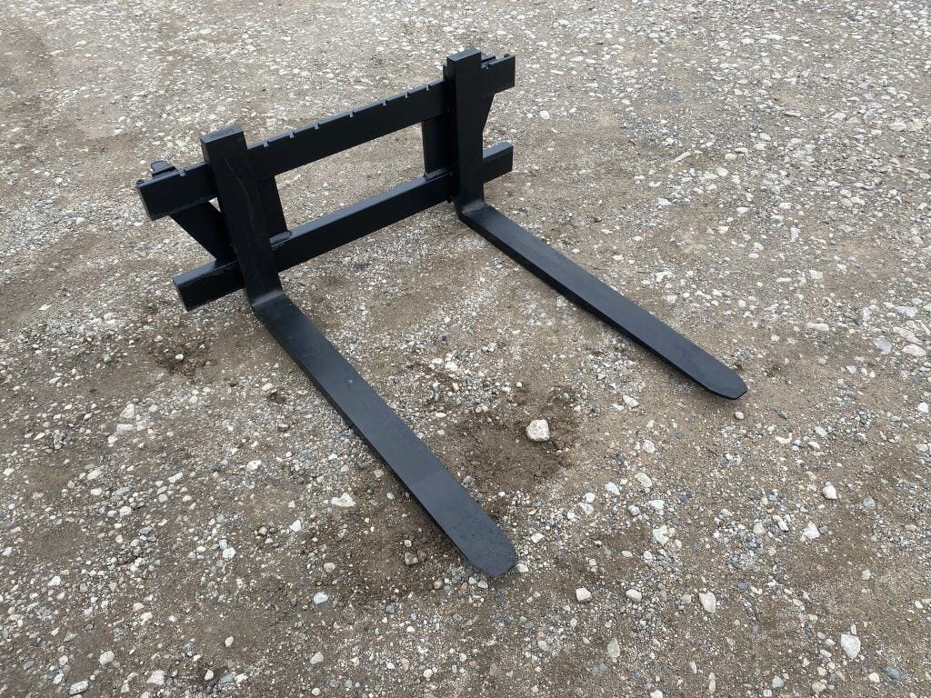 Heavy-duty steel forklift forks for industrial loading and lifting equipment.