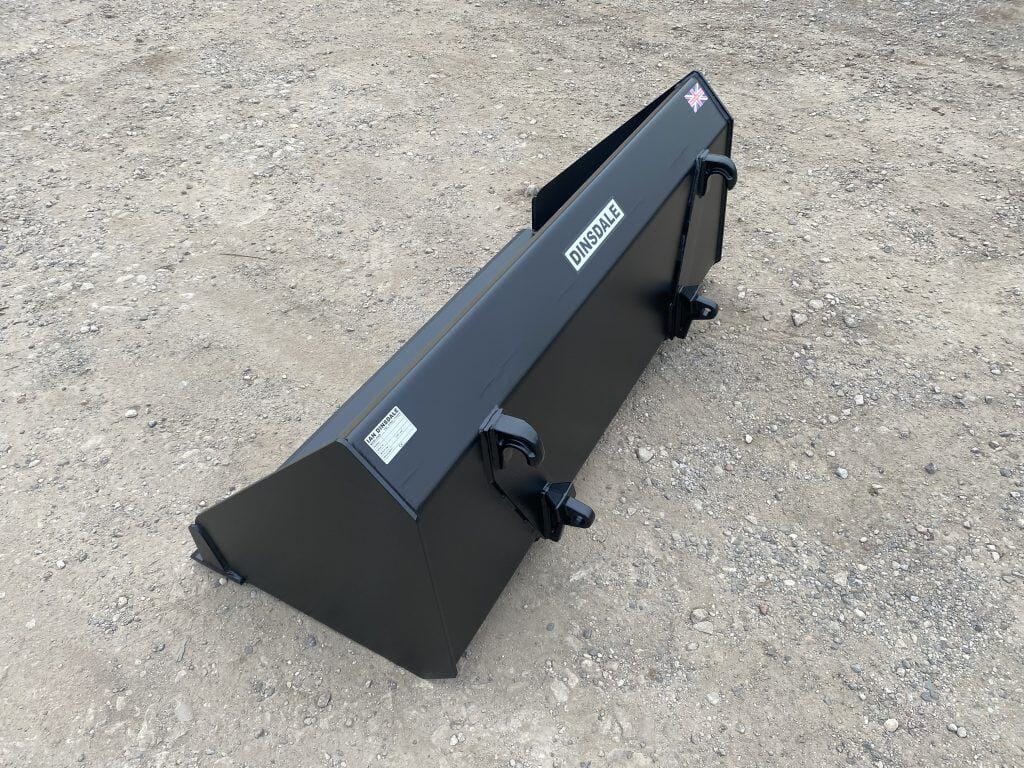 Black dump trailer with Dinsdale logo and UK flag, rugged construction for tough tasks.